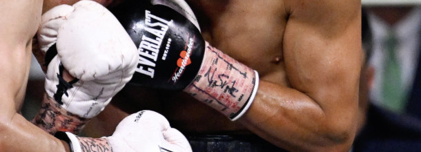 The gloves of two boxers during a boxing bout