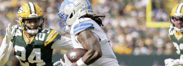 NFL players from the Packers and the Lions in action in an NFL game