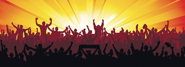 Sports fans celebrate looking at a sunset