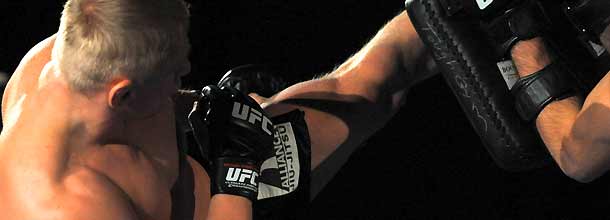 An MMA fighter in action in the octagon