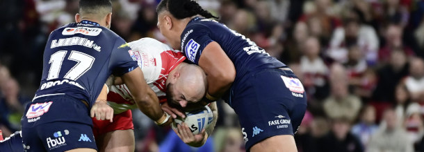 Wigan Warriors and Hull Kingston Rovers Rugby League players in action in a Super League game